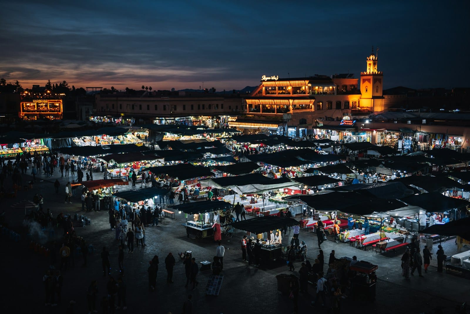 An aerial view of a market at night,activities to do in Marrakech