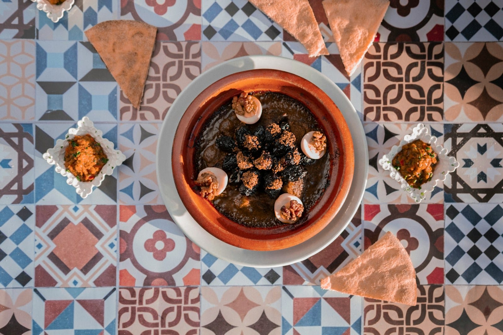 a bowl of food sitting on top of a table,Where and What to Eat in Morocco
