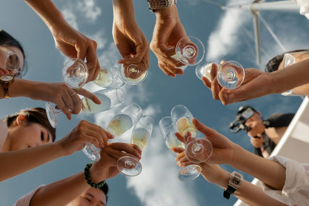 people holding clear glass bottles during daytime,alcohol in morocco​