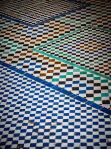 Geometric mosaic tiles in blue, white, and green.Moroccan Tiles Zellige