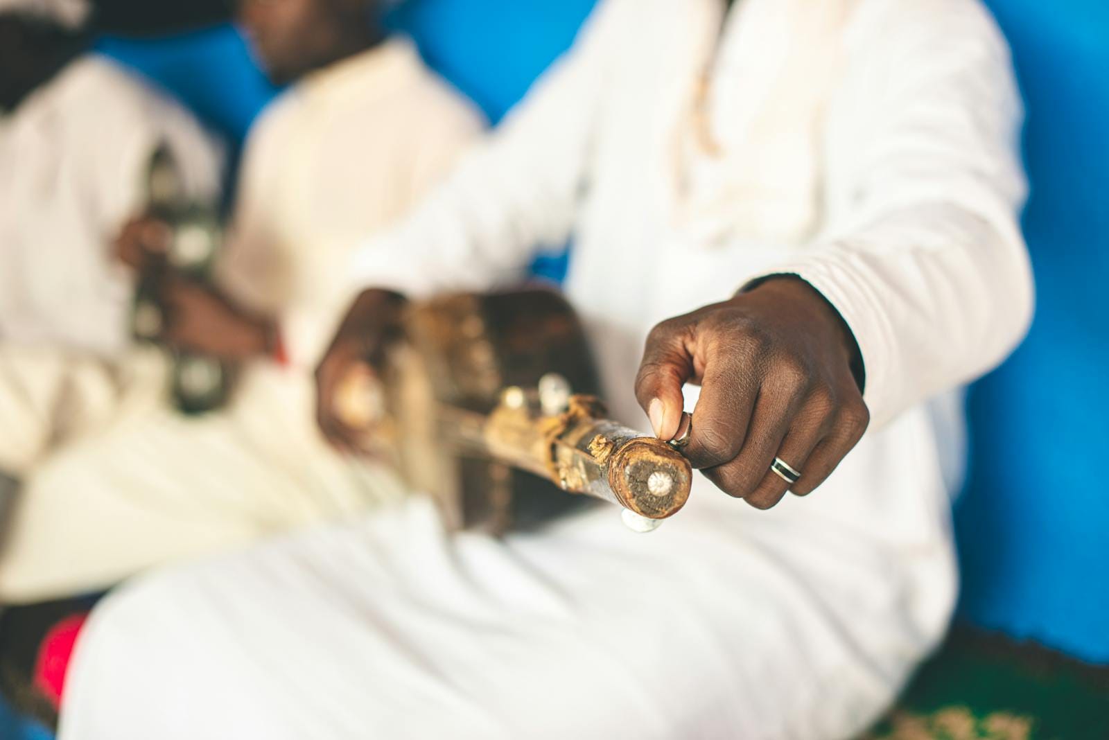 Close-up view of a traditional Moroccan instrument being played by a musician in Khemliya.Khamlia Morocco