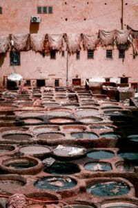 Historic leather tannery with dyed pits under the sun, showcasing traditional methods.Chouara Tannery