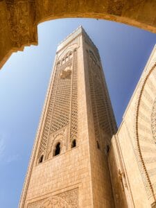 Stunning view of the Hassan II Mosque minaret against a clear blue sky in Casablanca, Morocco.Hassan II Mosque