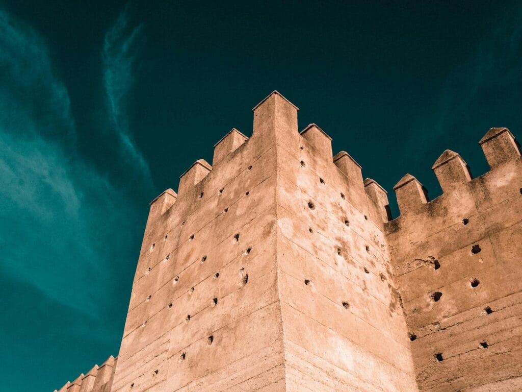 A stunning capture of the historic fortification wall in Fes, Morocco, showcasing traditional architecture.Weather in April Morocco