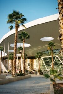 a building with palm trees in front of it,Major Airports