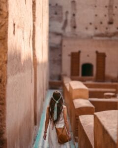 A tourist explores the historic El Badii Palace in Marrakesh, Morocco.disrespectful in Morocco