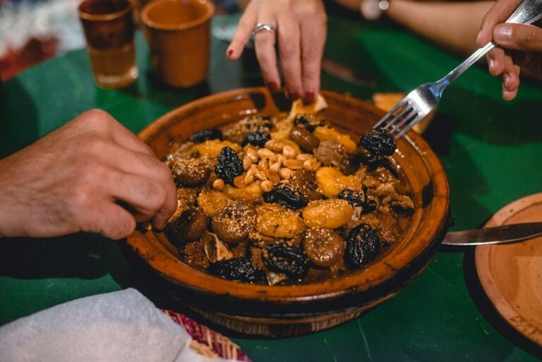 a person eating a bowl of food.Morocco with allergies