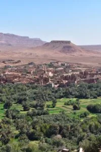 a landscape with trees and hills in the back.weather in Morocco in September