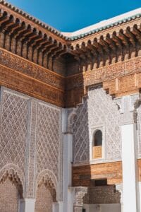 a white and brown building with a blue sky in the background.Marrakech or Casablanca