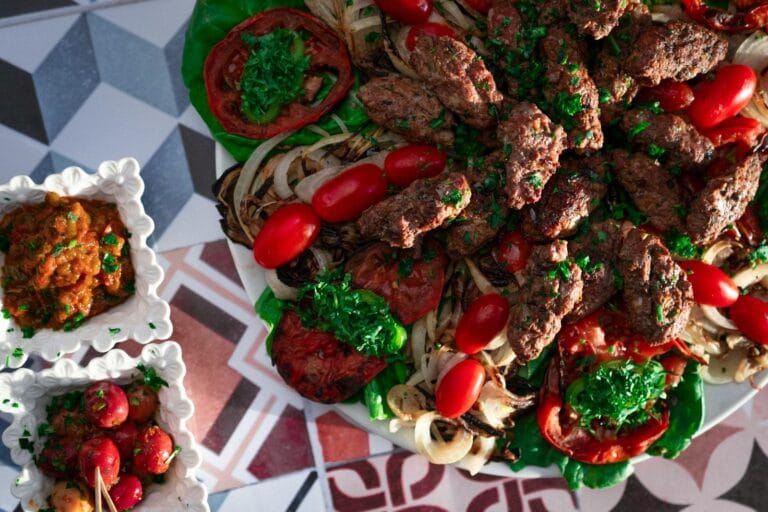 a platter of meat and vegetables on a table.Morocco with allergies