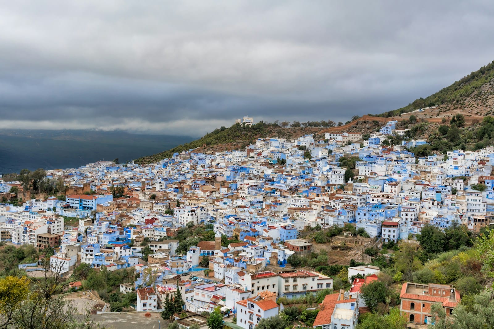 assorted-color concrete buildings during daytime.Morocco in August