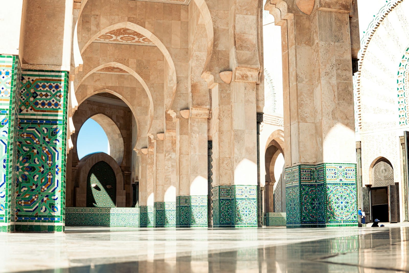 A large building with many arches and pillars.February for Ladies