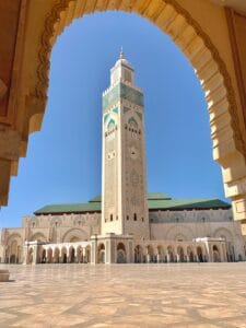 a tall clock tower towering over a city.Marrakech or Casablanca