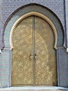 a large wooden door with intricate designs on it.What to Do in Fes Morocco