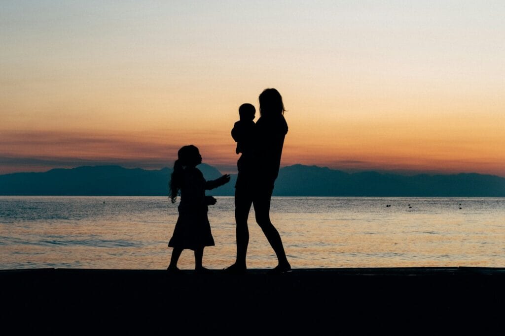 woman and children on beach shore.private tours in Morocco