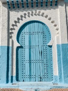 a blue door on a building.Marokko Blauwestad