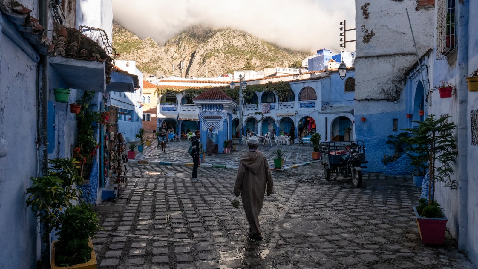 people walking on street in between concrete buildings during daytime.What to Wear in Morocco in March