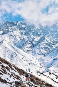 snow covered mountain under cloudy sky during daytime