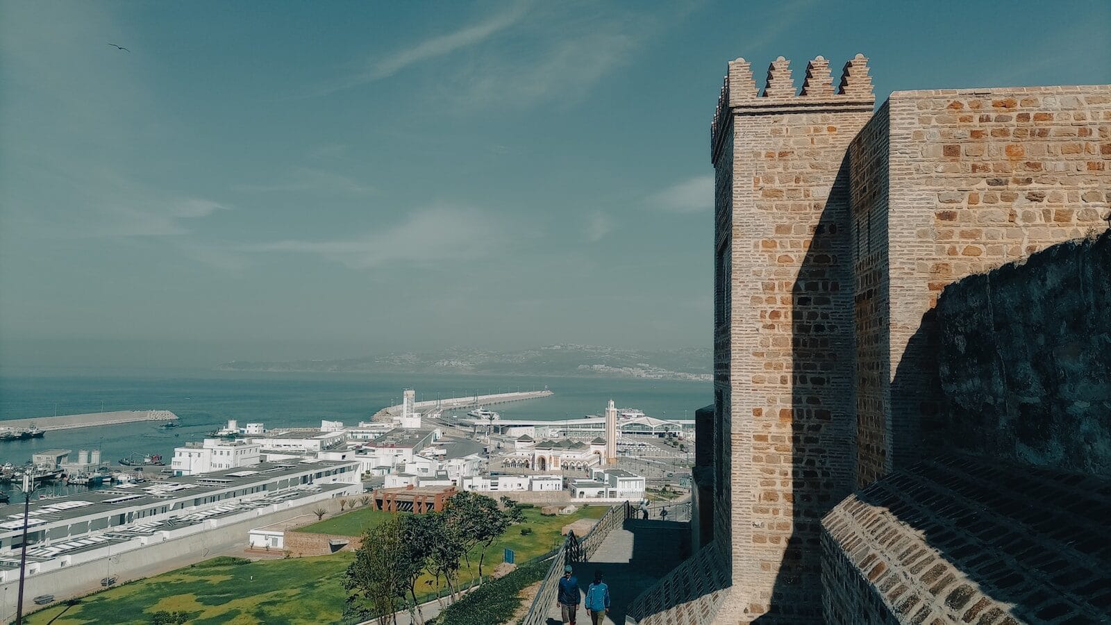 a large stone tower overlooking a city.Is Tangier Morocco Safe