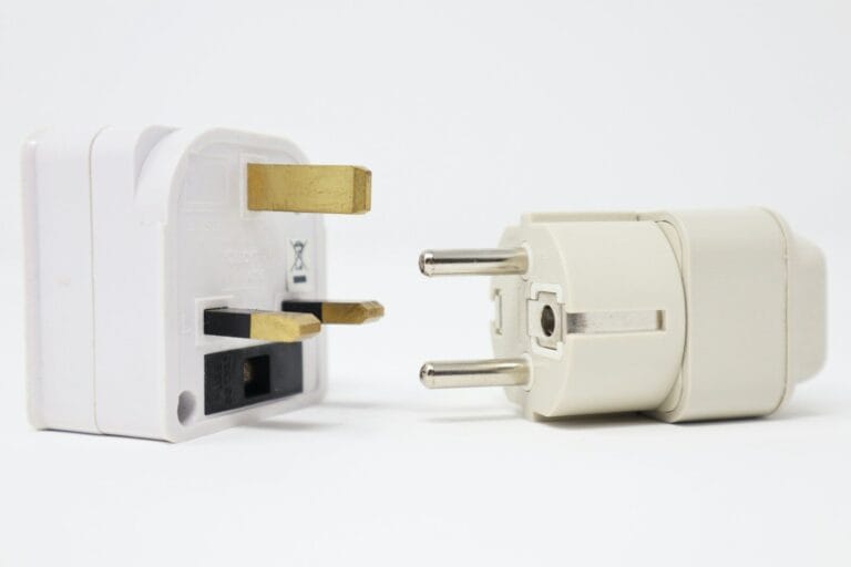 two white power adapters on white background.Morocco electrical plug type