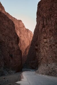 Discover the breathtaking beauty of Todgha Gorge in Morocco with towering rock formations at sunrise.