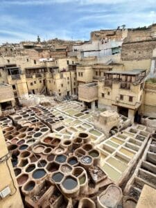 Explore the vibrant colors and textures of the historic Fez tannery in Morocco's cultural heart.