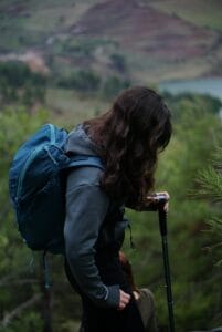 Young adult with backpack hiking in the scenic hills of Kahramanmaraş, Türkiye.
