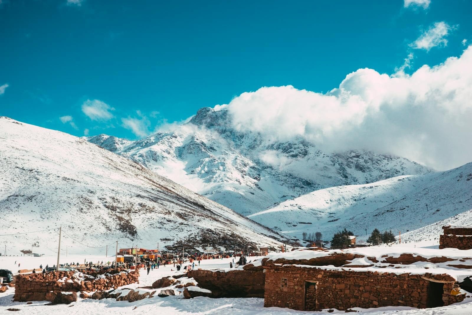 Snow-covered landscape in Oukaimeden, Morocco with scenic mountain views.Weather in Morocco in February