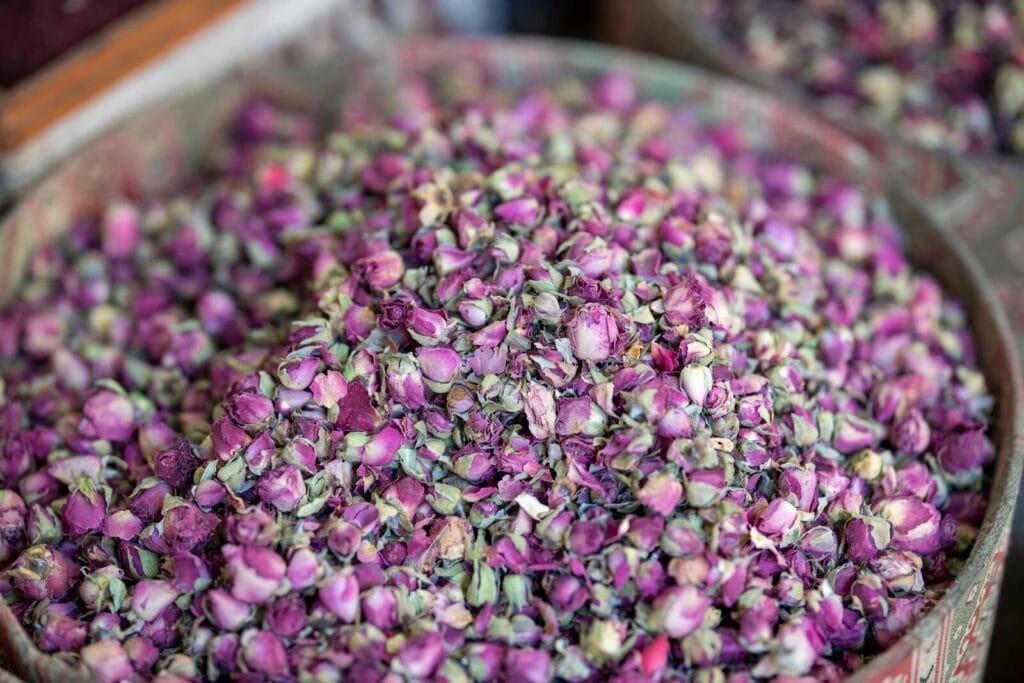 Aromatic pink rose buds piled in a bowl, perfect for tea, potpourri, or decor.Valley of Roses Morocco
