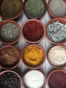 assorted spices in clear glass containers.Moroccan Spice Blend