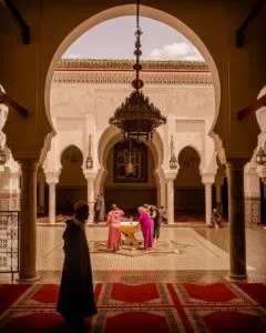 people standing beside fountain inside building during day.where is morocco found