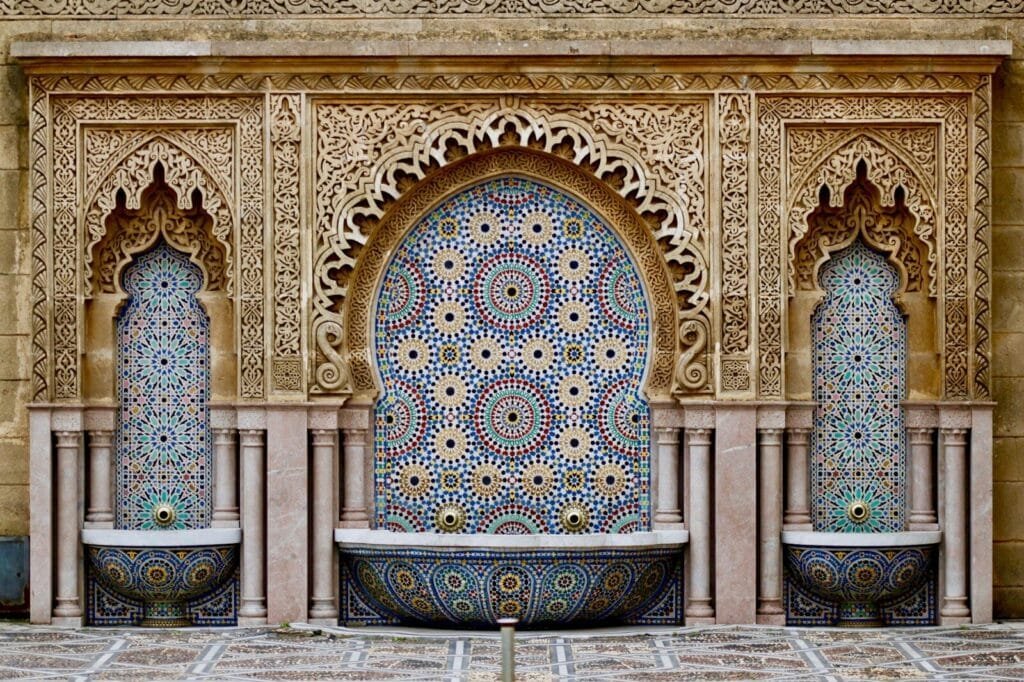 a decorative fountain in the middle of a courtyard.where is morocco found