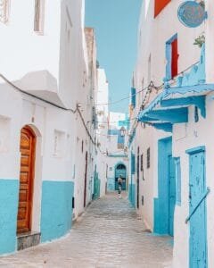 Scenic view of a colorful alley in Asilah, Morocco with traditional architecture.is Asilah safe