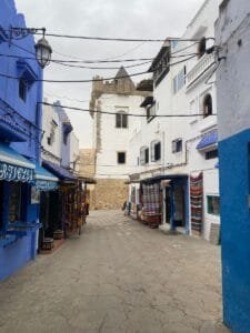 Discover the vibrant and colorful streets of Asilah, Morocco, under a moody sky.What to do in Asilah with kids?