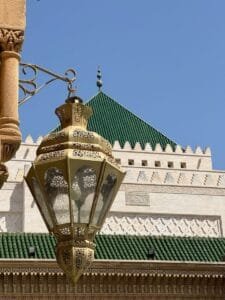 Decorative Moroccan lantern with Islamic architecture in Rabat under a clear blue sky.Lanterns in Morocco