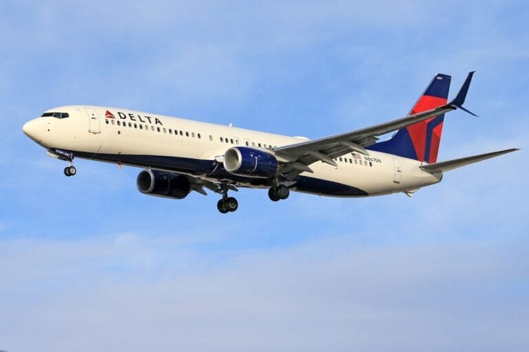 Delta airline passenger plane flying in clear blue sky. Ideal for travel and transportation themes.How long is the flight to Morocco