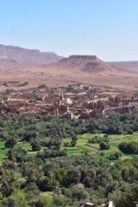 a landscape with trees and hills in the back.Tinghir Morocco