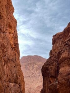 a man riding a horse through a canyon.Tinghir Morocco