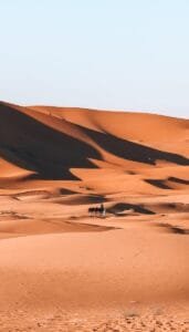 white and brown desert under blue sky during daytime.Fes to Merzouga