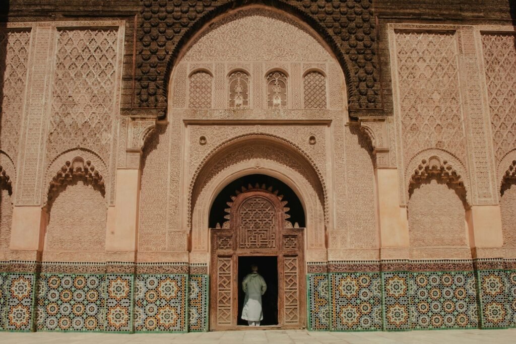 person standing on opened door of building.Morocco Etiquette
