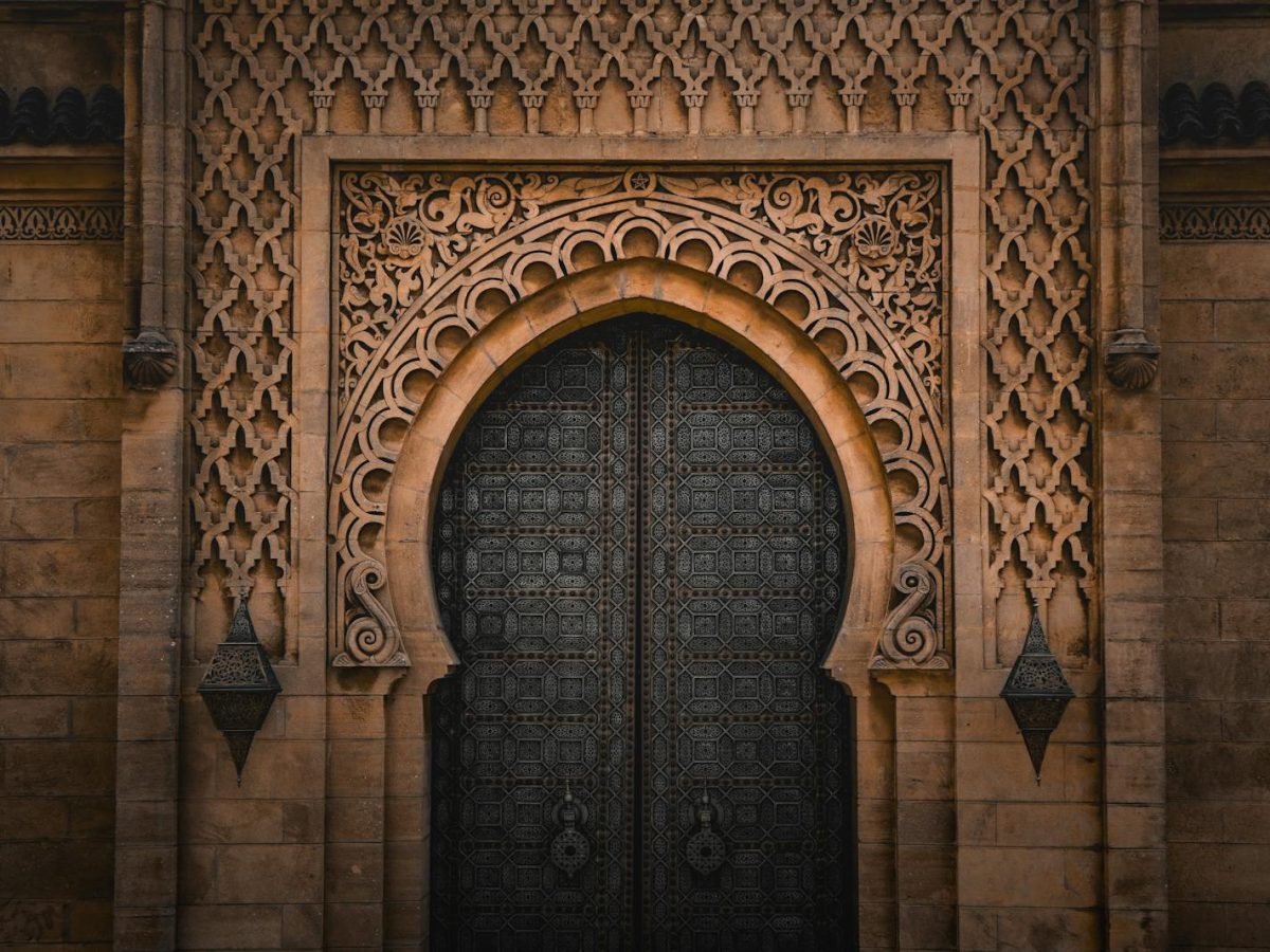 Detailed ornate Moroccan doorway showcasing Islamic architectural style in Rabat, Morocco.7 days tour from casablanca