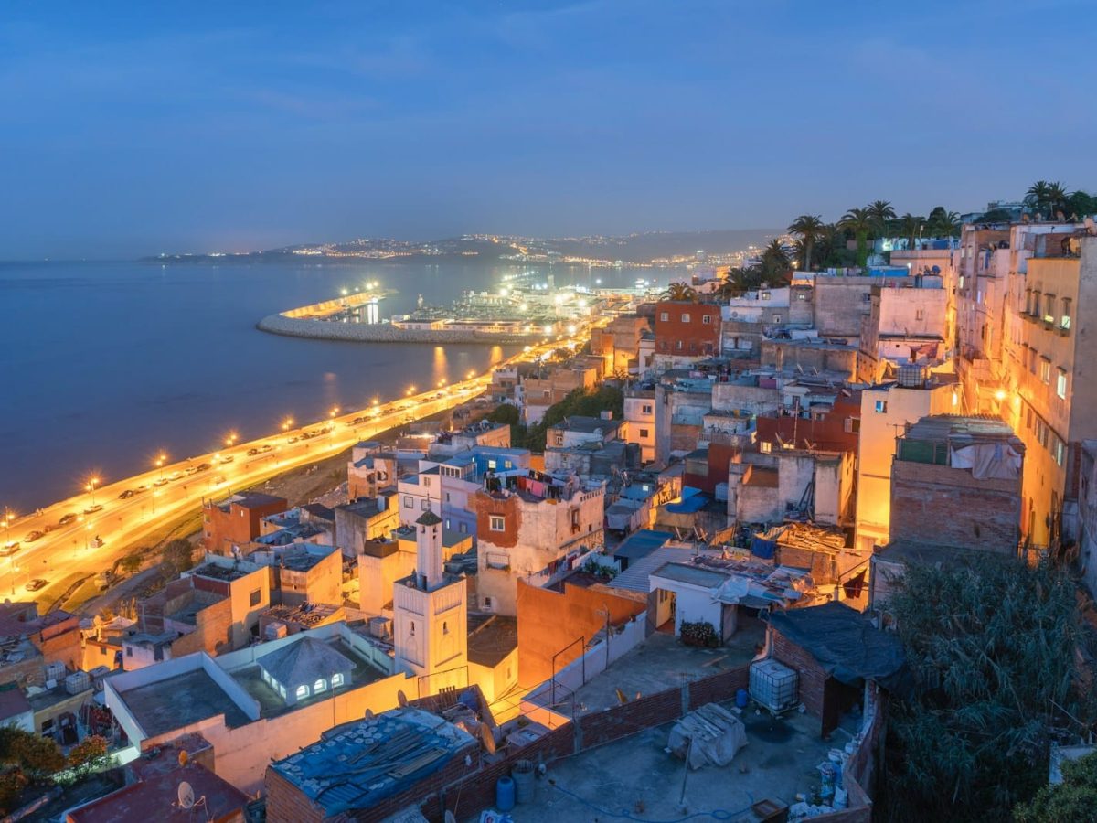 aerial view of city near body of water during night time,7 days tour from Tangier to Marrakech