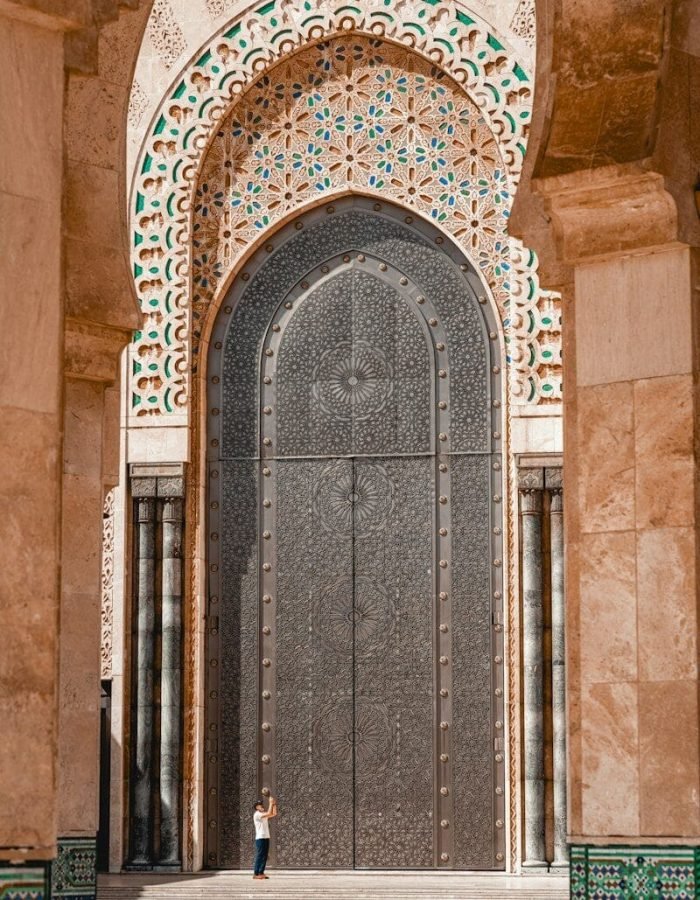 a person standing in front of a large door