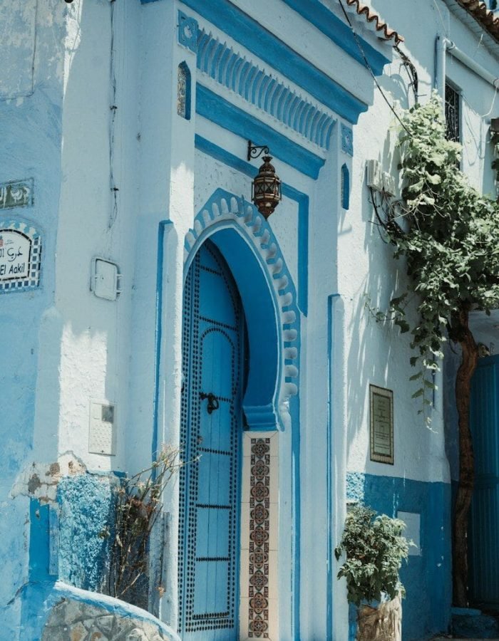 A blue and white building with a blue door