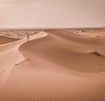person walking on desert,kate carter